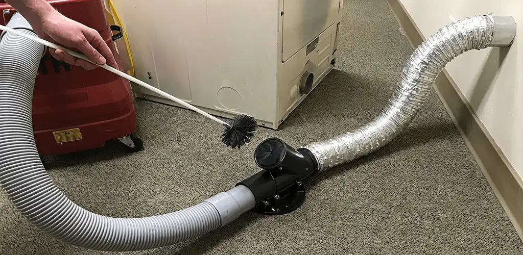 Dryer vent cleaning service removing lint from a dryer duct connection in San Jose, CA