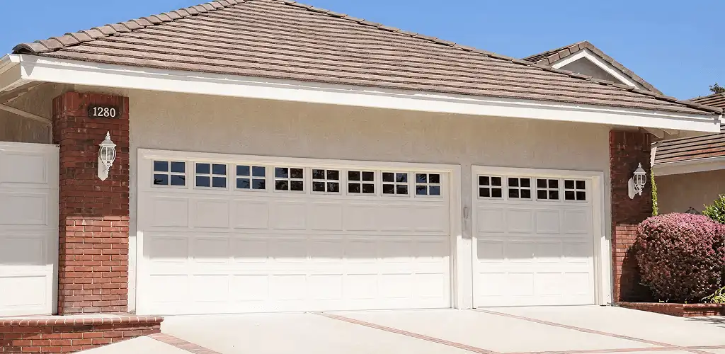 Residential garage door repair service for a double garage door in San Jose, CA