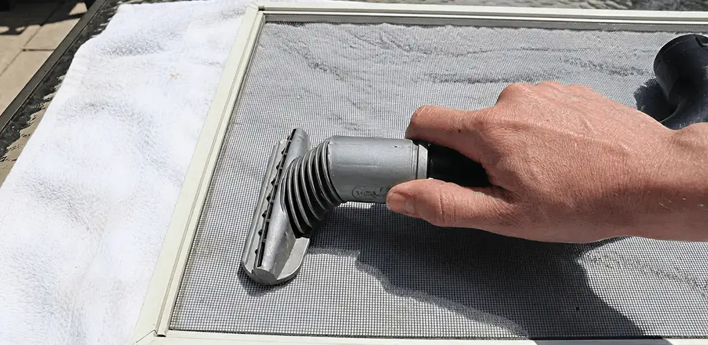 Window screen repair cleaning and fixing a damaged screen mesh in San Jose, CA