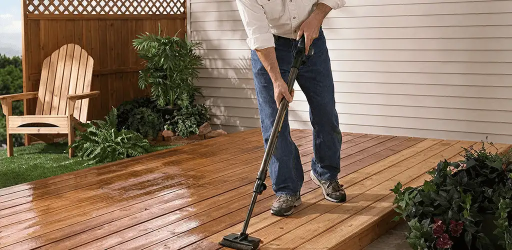 Deck staining service applying stain to a backyard wood deck in San Jose, CA